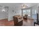 Spacious living room with hardwood floors and comfortable seating at 14950 W Mountain View Blvd # 1105, Surprise, AZ 85374