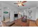 Living room with hardwood floors and built-in shelving at 14950 W Mountain View Blvd # 1105, Surprise, AZ 85374