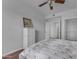 Spacious bedroom with a double bed, dresser, and ceiling fan at 14950 W Mountain View Blvd # 1105, Surprise, AZ 85374