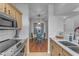 Modern kitchen with breakfast nook, stainless steel appliances, and light wood cabinets at 14950 W Mountain View Blvd # 1105, Surprise, AZ 85374