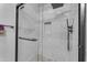 Large walk-in shower with marble tile and rain shower head at 14950 W Mountain View Blvd # 1105, Surprise, AZ 85374