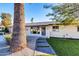 Front entry with walkway and mature palm tree at 8319 E Palm Ln, Scottsdale, AZ 85257