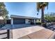 Modern home with gray garage door and long driveway at 8319 E Palm Ln, Scottsdale, AZ 85257