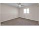 Simple bedroom with carpet and ceiling fan at 8319 E Palm Ln, Scottsdale, AZ 85257
