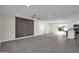 Spacious living room with tile floors and a modern wood accent wall at 8319 E Palm Ln, Scottsdale, AZ 85257
