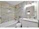 Modern bathroom with marble tile and gold fixtures at 8319 E Palm Ln, Scottsdale, AZ 85257