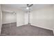 Bedroom with mirrored closet doors and ceiling fan at 8319 E Palm Ln, Scottsdale, AZ 85257