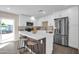 Modern kitchen with white cabinets, stainless steel appliances, and quartz countertops at 8319 E Palm Ln, Scottsdale, AZ 85257
