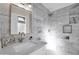 Modern bathroom with marble tile, a large shower, and updated vanity at 8319 E Palm Ln, Scottsdale, AZ 85257