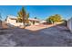 Large backyard with mature trees and a spacious patio at 8319 E Palm Ln, Scottsdale, AZ 85257
