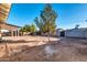 Backyard with mature trees and a brick patio at 8319 E Palm Ln, Scottsdale, AZ 85257