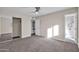 Spacious bedroom with mirrored closet doors and carpet flooring at 8319 E Palm Ln, Scottsdale, AZ 85257