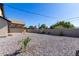 Backyard view of house, showing gravel and fence at 1921 E Yale St, Phoenix, AZ 85006