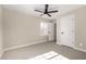 Spacious bedroom with ceiling fan and carpet at 1921 E Yale St, Phoenix, AZ 85006