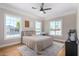 Spacious bedroom with light walls, hardwood floors, and a ceiling fan at 1921 E Yale St, Phoenix, AZ 85006