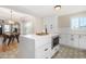 Modern white kitchen with island and custom tile flooring at 1921 E Yale St, Phoenix, AZ 85006