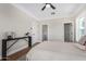 Cozy bedroom with hardwood floors, neutral decor, and access to a full bathroom at 1921 E Yale St, Phoenix, AZ 85006