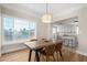 Bright dining room features hardwood floors and a view into the kitchen at 1921 E Yale St, Phoenix, AZ 85006