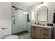 Modern bathroom with a walk-in shower, hexagon tile, and stylish vanity at 1921 E Yale St, Phoenix, AZ 85006