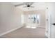 Spacious bedroom with neutral carpeting and large window at 1921 E Yale St, Phoenix, AZ 85006