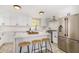 Modern kitchen with stainless steel appliances, white cabinets and a spacious island at 1921 E Yale St, Phoenix, AZ 85006