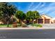 Single-story home with a two-car garage and artificial turf at 2652 N 143Rd Dr, Goodyear, AZ 85395