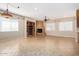 Gathering room with a stone fireplace and built in shelving at 2652 N 143Rd Dr, Goodyear, AZ 85395