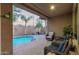 Covered patio with comfortable seating overlooking the pool at 6181 S Granite Dr, Chandler, AZ 85249