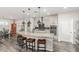 Island kitchen with granite countertops, stainless steel appliances, and pendant lighting at 6181 S Granite Dr, Chandler, AZ 85249