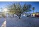 Quaint single-story home with a gravel front yard and mature tree at 8836 N 28Th Dr, Phoenix, AZ 85051