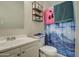 Simple bathroom with a white vanity, toilet, and shower at 8836 N 28Th Dr, Phoenix, AZ 85051