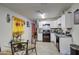 Modern kitchen with white cabinets, granite countertops, and stainless steel appliances at 8836 N 28Th Dr, Phoenix, AZ 85051