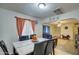 Dining area with a marble-top table and six black leather chairs at 8836 N 28Th Dr, Phoenix, AZ 85051
