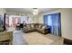 Open living room featuring a leather sectional sofa and view into dining area at 8836 N 28Th Dr, Phoenix, AZ 85051
