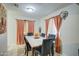 Bright dining room with a marble table and seating for six at 8836 N 28Th Dr, Phoenix, AZ 85051