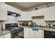Modern kitchen with white cabinets and granite countertops at 8836 N 28Th Dr, Phoenix, AZ 85051
