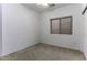 Small bedroom with window blinds and ceiling fan at 1848 E Sycamore Rd, Casa Grande, AZ 85122