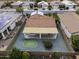 Home's backyard, showcasing a covered patio and putting green at 1848 E Sycamore Rd, Casa Grande, AZ 85122