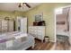 Bedroom with dresser, hardwood floors and view of bathroom at 2650 W Union Hills Dr # 344, Phoenix, AZ 85027