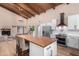 Modern kitchen with a large island, stainless steel appliances, and wood accents at 4601 E Carolina Dr, Phoenix, AZ 85032