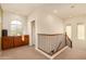 Upstairs hallway with wood cabinets and a view to the lower level at 5423 W Range Mule Dr, Phoenix, AZ 85083