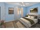 Bedroom with queen bed, neutral decor, and ceiling fan at 1017 E Grandview Rd, Phoenix, AZ 85022