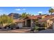Single-story home with tile roof, desert landscaping, and mountain views at 1017 E Grandview Rd, Phoenix, AZ 85022