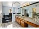 Bathroom with double vanity, soaking tub, and separate shower at 1017 E Grandview Rd, Phoenix, AZ 85022