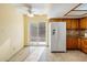 Kitchen features wood cabinets, granite countertops, and sliding door to patio at 1017 E Grandview Rd, Phoenix, AZ 85022