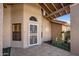 Covered entryway with tiled flooring and wrought iron door at 1017 E Grandview Rd, Phoenix, AZ 85022