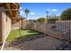Artificial turf and gravel backyard with a metal fence at 1017 E Grandview Rd, Phoenix, AZ 85022