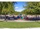 Community playground with play structures and swings at 1017 E Grandview Rd, Phoenix, AZ 85022