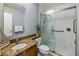 Bathroom with granite countertop, single sink, and walk-in shower at 1017 E Grandview Rd, Phoenix, AZ 85022