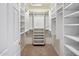 Spacious walk-in closet with ample shelving and hanging space at 1017 E Grandview Rd, Phoenix, AZ 85022